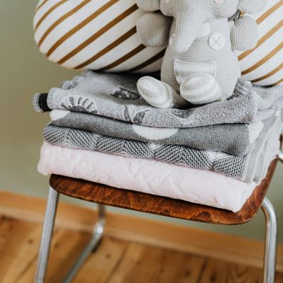 A stack of folded yoga blankets.