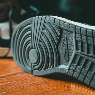 Bare feet on a wooden floor, ready for practice.